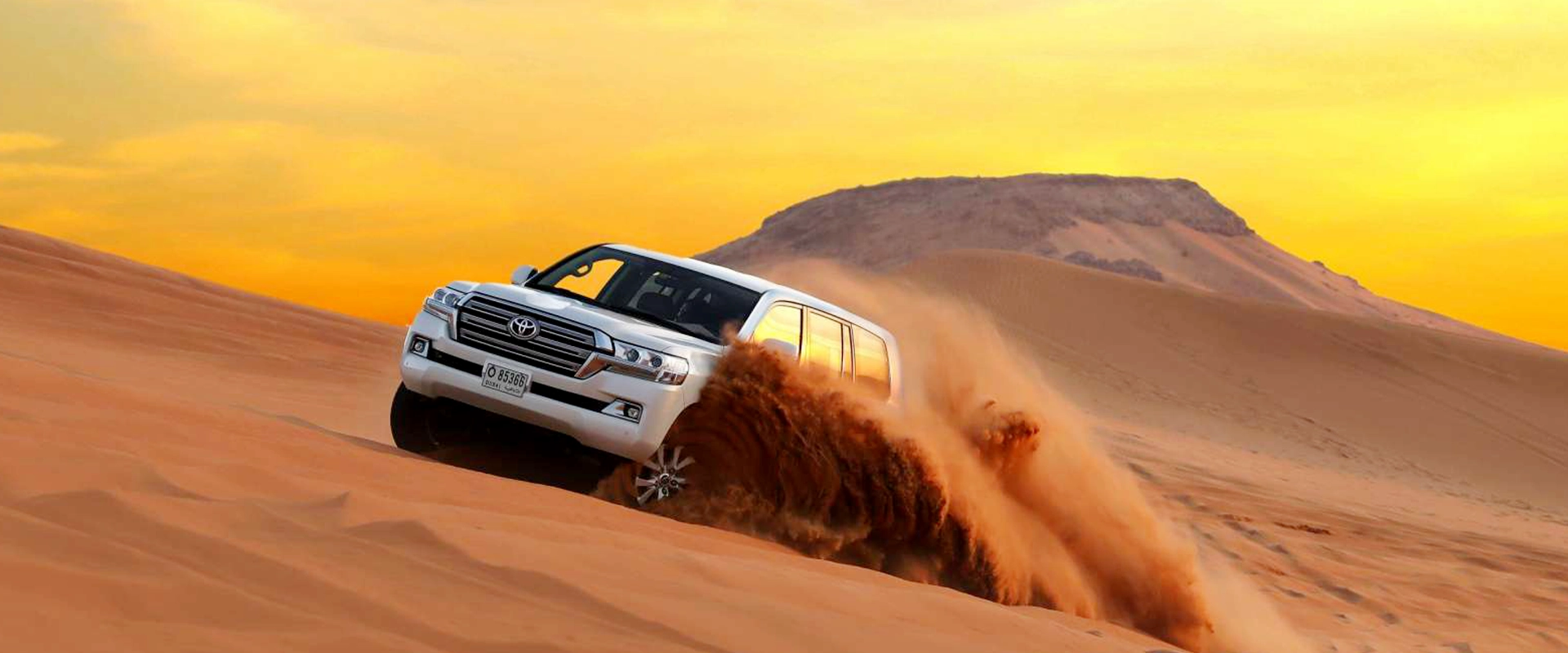 Desert Adventures | WPJ Travel 7 4x4 vehicle dune bashing during Dubai desert safari at sunset