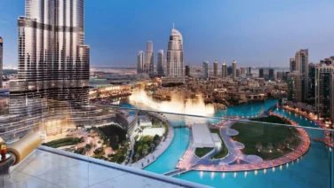 Aerial evening view of Dubai Fountain and Burj Khalifa in Downtown Dubai