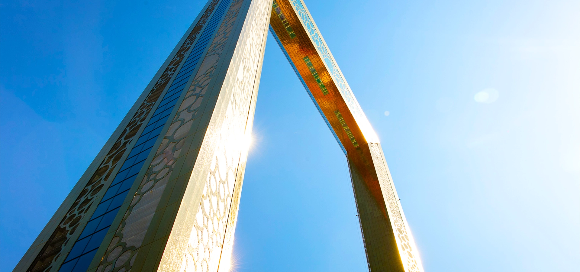 Dubai Frame illuminated at sunset with panoramic city skyline views