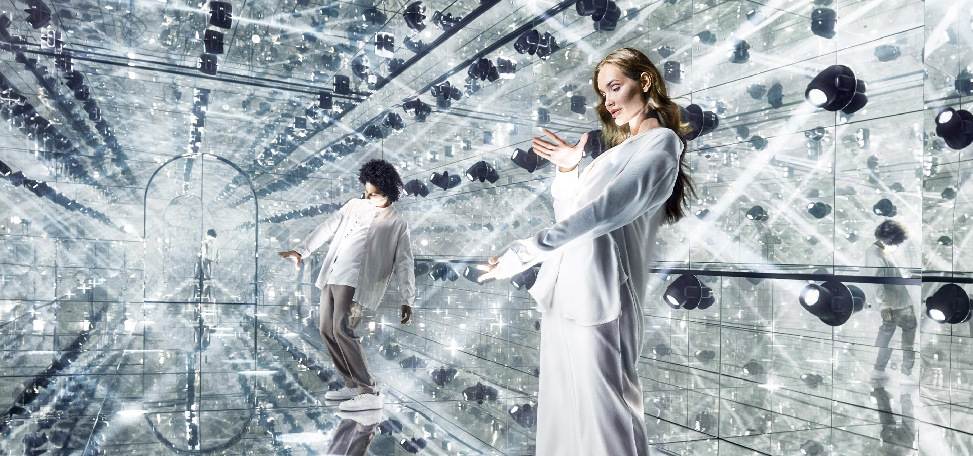 Visitors exploring glowing immersive light installations inside AYA Universe Dubai.