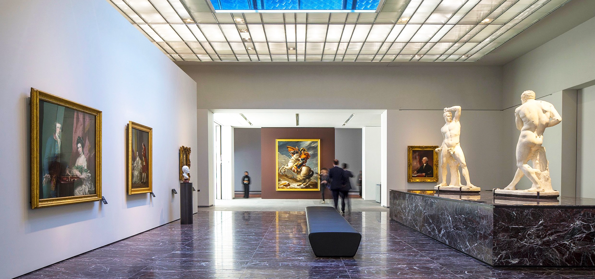 Louvre Abu Dhabi exterior with iconic dome and reflection on Saadiyat Island, UAE.