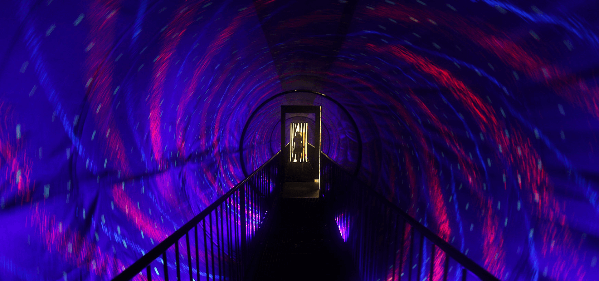 Visitors enjoying interactive exhibits at Museum of Illusions Dubai.