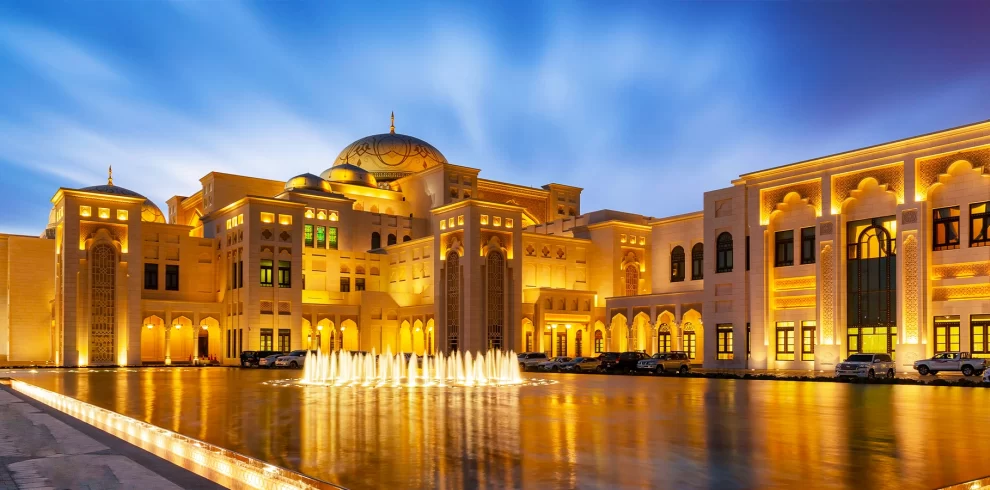Qasr Al Watan Abu Dhabi Presidential Palace exterior with domes, gardens, and sunset lighting