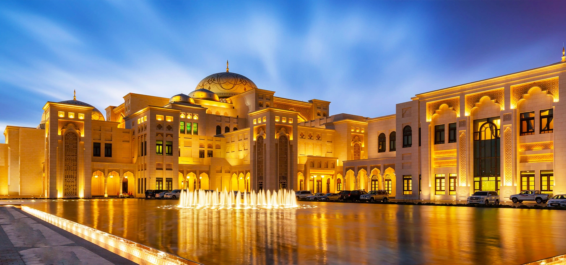 Qasr Al Watan Abu Dhabi Presidential Palace exterior with domes, gardens, and sunset lighting